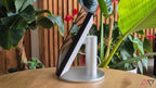 Tasty Tech Amazon Echo Show 15 (2nd Gen) smart display with a 15.6" Full HD screen and silver stand, set against lush greenery.